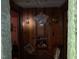 Cozy hallway featuring paneled walls, decorative lighting, and vintage decor at 1806 Rendall St, Burlington, NC 27215
