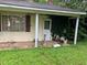 Charming bungalow-style home with a covered front porch, lush greenery, and a serene setting at 1806 Rendall St, Burlington, NC 27215