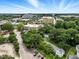 Aerial view showcasing the neighborhood with lush trees and nearby community features at 1904 Smallwood Dr, Raleigh, NC 27605