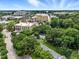 Aerial view of the neighborhood showcasing tree-lined streets and nearby buildings at 1904 Smallwood Dr, Raleigh, NC 27605