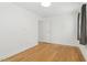Bright bedroom featuring hardwood floors and a neutral color palette at 1904 Smallwood Dr, Raleigh, NC 27605