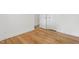 Hallway featuring beautiful hardwood floors and a neutral color palette at 1904 Smallwood Dr, Raleigh, NC 27605