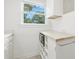 Bright kitchen with countertops and a view to the outdoors from the window at 1904 Smallwood Dr, Raleigh, NC 27605
