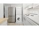 Stainless steel refrigerator, stove, and washer/dryer in a bright kitchen at 1904 Smallwood Dr, Raleigh, NC 27605