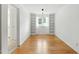 Bright room featuring hardwood floors, built-in shelves, and a window that allows for natural light at 1904 Smallwood Dr, Raleigh, NC 27605