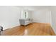 Bright living room featuring hardwood floors and a comfortable gray couch at 1904 Smallwood Dr, Raleigh, NC 27605
