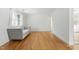 Bright living room with hardwood floors and natural light from the window at 1904 Smallwood Dr, Raleigh, NC 27605