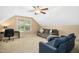 Spacious bonus room with a desk, sofa, and comfortable seating area at 210 Water Oak Way, Louisburg, NC 27549