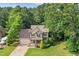 Charming two-story home with well-manicured landscaping, a two-car garage, and a welcoming front porch at 210 Water Oak Way, Louisburg, NC 27549