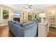 Spacious living area with a fireplace, large sectional sofa, and seamless flow to the dining and kitchen areas at 210 Water Oak Way, Louisburg, NC 27549