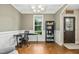 Bright office space with coffered ceilings, hardwood floors, and a large window offering plenty of natural light at 210 Water Oak Way, Louisburg, NC 27549
