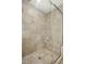 Tiled shower with glass doors and a convenient built-in shelf for bath products at 210 Water Oak Way, Louisburg, NC 27549