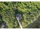 Aerial view of the home on wooded acreage at 2124 Country Air Ln, Hillsborough, NC 27278