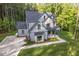An aerial shot showcases this home's well-kept yard and expansive driveway at 2124 Country Air Ln, Hillsborough, NC 27278