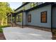 Beautiful outdoor space featuring a covered back porch and an adjoining concrete patio at 2124 Country Air Ln, Hillsborough, NC 27278