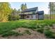Expansive backyard with lush green grass and mature trees at 2124 Country Air Ln, Hillsborough, NC 27278