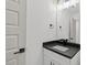 Modern bathroom with black hardware, white vanity, and neutral paint at 2124 Country Air Ln, Hillsborough, NC 27278