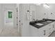 Modern bathroom with double vanity, granite countertop and stylish fixtures; bedroom access to the left at 2124 Country Air Ln, Hillsborough, NC 27278