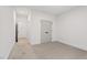 Spacious bedroom featuring neutral carpet, access to other rooms, and natural light at 2124 Country Air Ln, Hillsborough, NC 27278