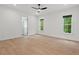 This bedroom offers hardwood flooring and natural lighting at 2124 Country Air Ln, Hillsborough, NC 27278
