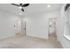 Bright bedroom with neutral carpet, white walls, and ensuite bath access create a serene retreat at 2124 Country Air Ln, Hillsborough, NC 27278