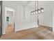 Bright dining room showing view into the hallway and stairwell at 2124 Country Air Ln, Hillsborough, NC 27278
