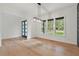 Spacious dining room with hardwood floors and abundant natural light at 2124 Country Air Ln, Hillsborough, NC 27278