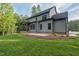 Exterior of the home featuring a screened porch, patio, and yard at 2124 Country Air Ln, Hillsborough, NC 27278