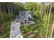 New construction craftsman-style home with driveway and mature trees at 2124 Country Air Ln, Hillsborough, NC 27278