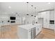 Bright kitchen with large island, pendant lighting, stainless appliances, and an open floor plan at 2124 Country Air Ln, Hillsborough, NC 27278