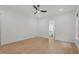 Spacious bedroom with hardwood floors, ceiling fan, and an ensuite bathroom at 2124 Country Air Ln, Hillsborough, NC 27278