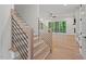 Modern staircase with sleek metal railings and access to living area at 2124 Country Air Ln, Hillsborough, NC 27278