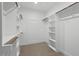 Well-organized walk-in closet with ample shelving and hanging space for storage at 2124 Country Air Ln, Hillsborough, NC 27278