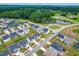 An aerial view of the community with a pond and swimming pool at 222 Oak Branch - Lot 72 Trl, Garner, NC 27529
