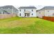 Large backyard with a well-kept lawn, patio, and view of the back of the home at 222 Oak Branch - Lot 72 Trl, Garner, NC 27529