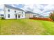 Expansive backyard showcasing a well-maintained lawn, patio, and neighboring houses at 222 Oak Branch - Lot 72 Trl, Garner, NC 27529