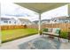Spacious backyard featuring a manicured lawn, patio, and neighboring houses at 222 Oak Branch - Lot 72 Trl, Garner, NC 27529