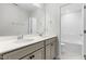 Bathroom featuring double sink vanity with granite countertop, tub/shower combo and tile floors at 222 Oak Branch - Lot 72 Trl, Garner, NC 27529