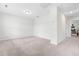 Spacious bedroom with neutral carpet and light fixtures, ready for personalization at 222 Oak Branch - Lot 72 Trl, Garner, NC 27529