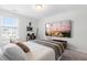 Neutral bedroom features mounted television, queen bed, and modern decorative accents at 222 Oak Branch - Lot 72 Trl, Garner, NC 27529