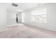 Bright bedroom featuring a large window and neutral carpet, ready for new occupants at 222 Oak Branch - Lot 72 Trl, Garner, NC 27529