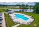 The community pool area is visible with a fence, lounge chairs, tables and umbrellas at 222 Oak Branch - Lot 72 Trl, Garner, NC 27529