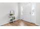 Bright entryway with wood flooring, white walls, and a white front door with sidelights at 222 Oak Branch - Lot 72 Trl, Garner, NC 27529