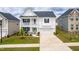 Charming two-story home featuring a double front porch and a well-maintained lawn at 222 Oak Branch - Lot 72 Trl, Garner, NC 27529