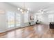 Spacious living room with a modern light fixture, hardwood floors, and French doors leading to the backyard at 222 Oak Branch - Lot 72 Trl, Garner, NC 27529