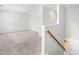 Bright neutral bonus room space featuring stairs and a view to additional living area at 222 Oak Branch - Lot 72 Trl, Garner, NC 27529