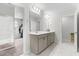 Stylish main bathroom featuring a double vanity, sleek countertops, and a well-lit mirror at 222 Oak Branch - Lot 72 Trl, Garner, NC 27529