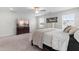 Comfortable main bedroom with neutral carpet, a ceiling fan, large windows, and ample natural light at 222 Oak Branch - Lot 72 Trl, Garner, NC 27529