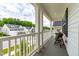 Inviting covered porch with comfortable seating, perfect for enjoying the outdoors at 222 Oak Branch - Lot 72 Trl, Garner, NC 27529