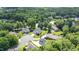 An aerial view showing several homes on the cul-de-sac street in a wooded community at 2333 Grey Gables Dr, Burlington, NC 27215